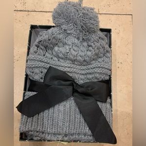 NWT. Knit hat and scarf set with all inclusive box. Never removed from box.